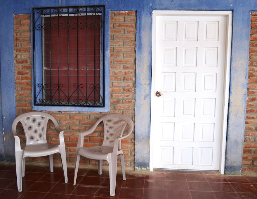 Small area outside the room with chairs