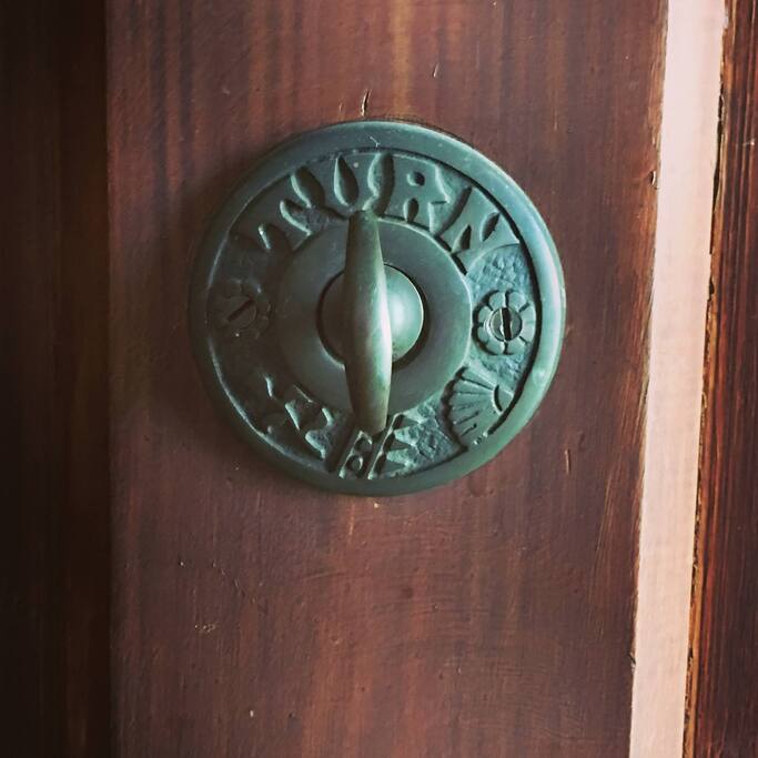 Original doorbell - one of the many pieces of history carefully preserved on the property.