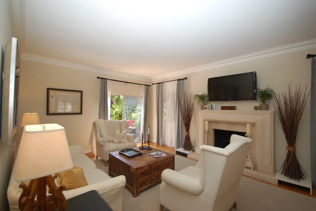 Step down living room with tall ceilings and tons of natural light.