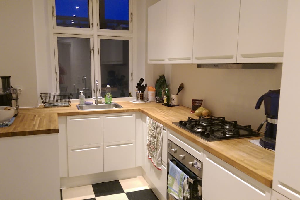 Spacious kitchen with coffee machine and other amenities