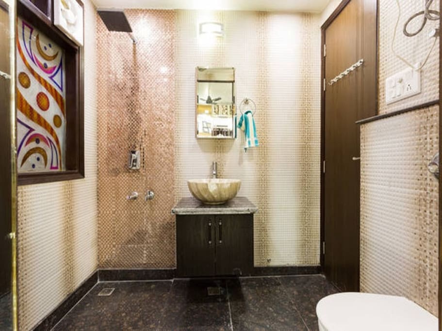 Common Bathroom with walkin rain shower, sink and toilet