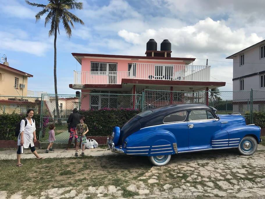 Some guests arriving at our 50’s modernist style home. It could be you! All the rooms have been refurbished and are clean and bright. Notice the sun terrace on the 1st floor.