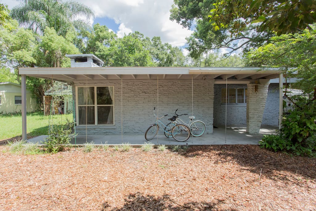 Restored mid century home, landscaped for privacy from the street, a block from major east- west street.