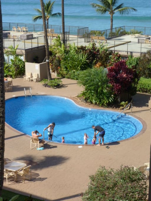 A beautiful pool with loungers and tables to relax.