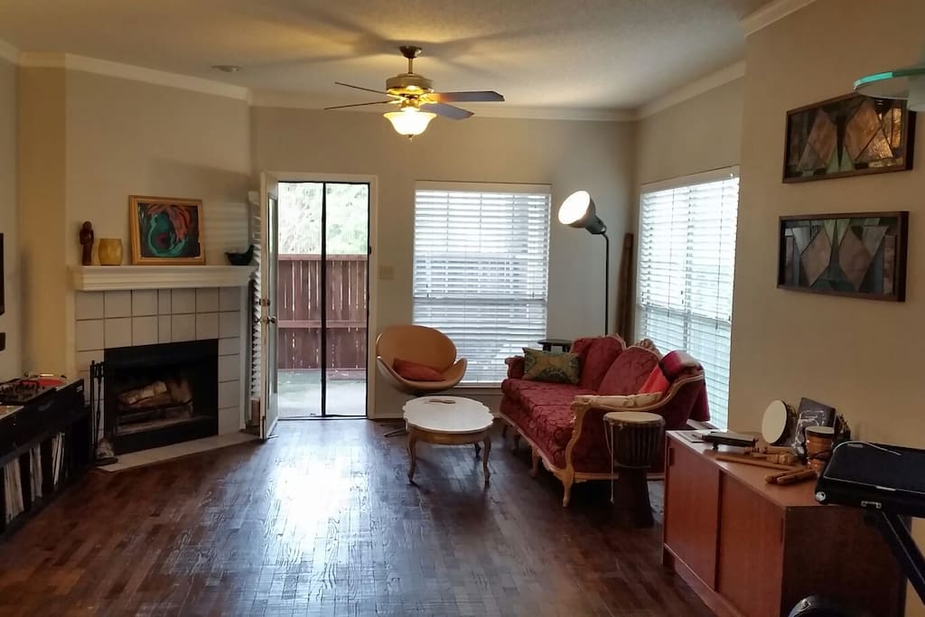 Living room with back door to privately fenced yard.