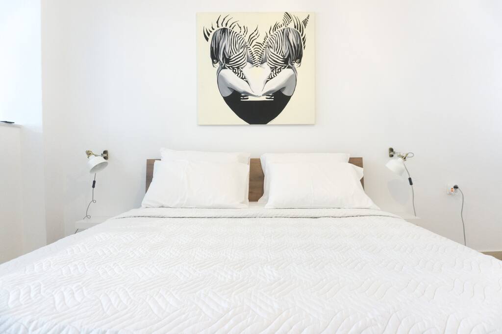 The double bed in bedroom #1