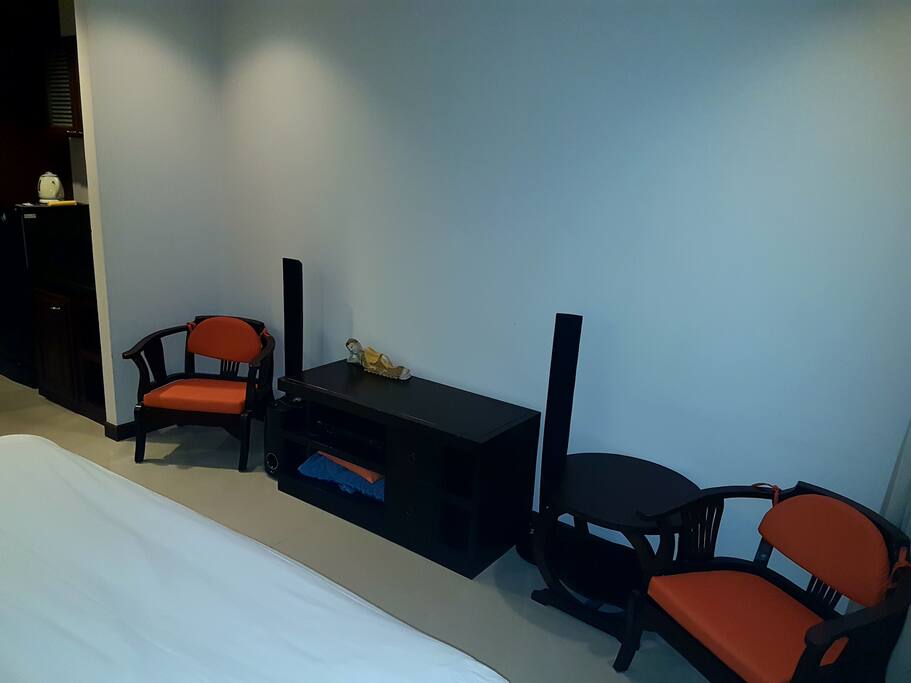 armchairs, small round table, sound system