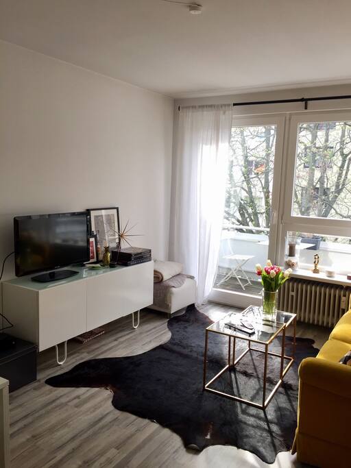 Cozy living room with entry to balcony