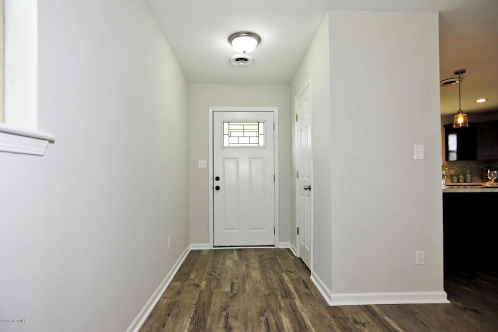 Entry way with closet to store luggage and hang up jackets. Beautiful hardwood laminate flooring through most of the home.