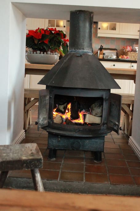 Fireplace with stove connecting Living Room and Kitchen / Diner
