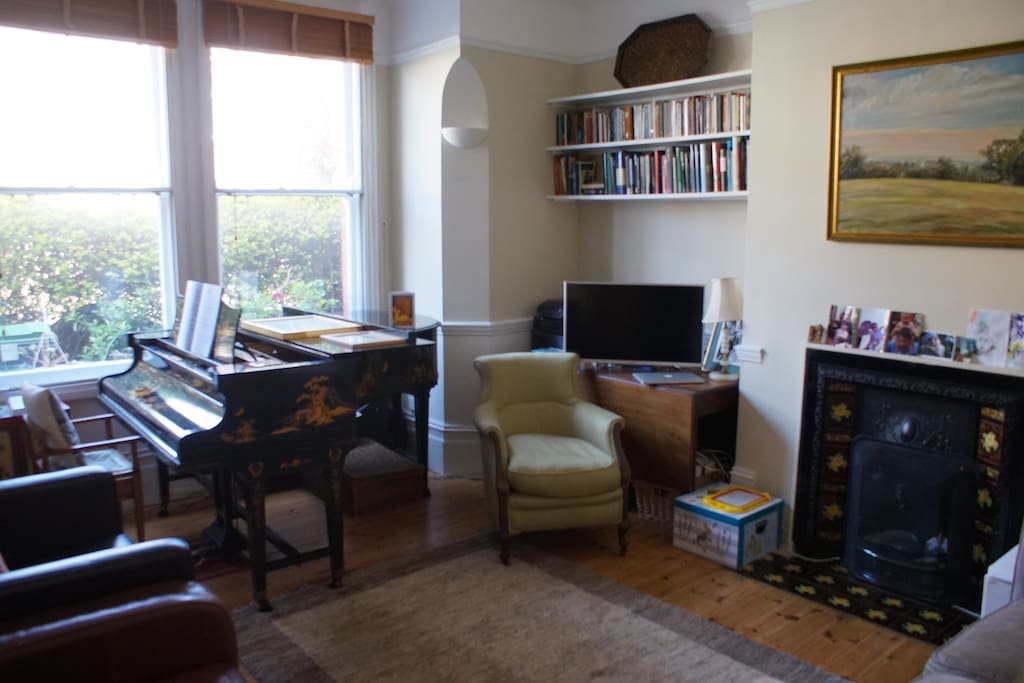 Front living room with piano and television