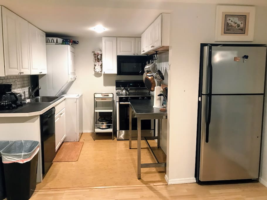 A kitchen with your own washer/dryer. Small but well equipped kitchen with a full-sized fridge, and stove/oven, microwave, dishwasher, and disposer.