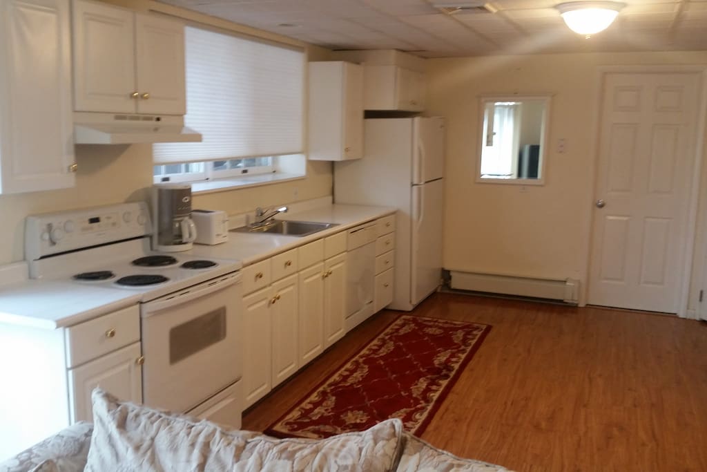 Full Eat -In Kitchen with dishwasher, toaster, coffe pot, dishes and utensils