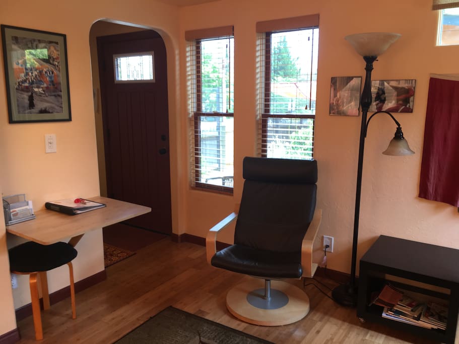 Table, Reading Chair, & private front garden view.
