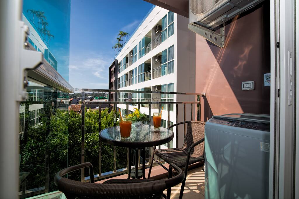 Your private balcony with outside furniture and washing machine!