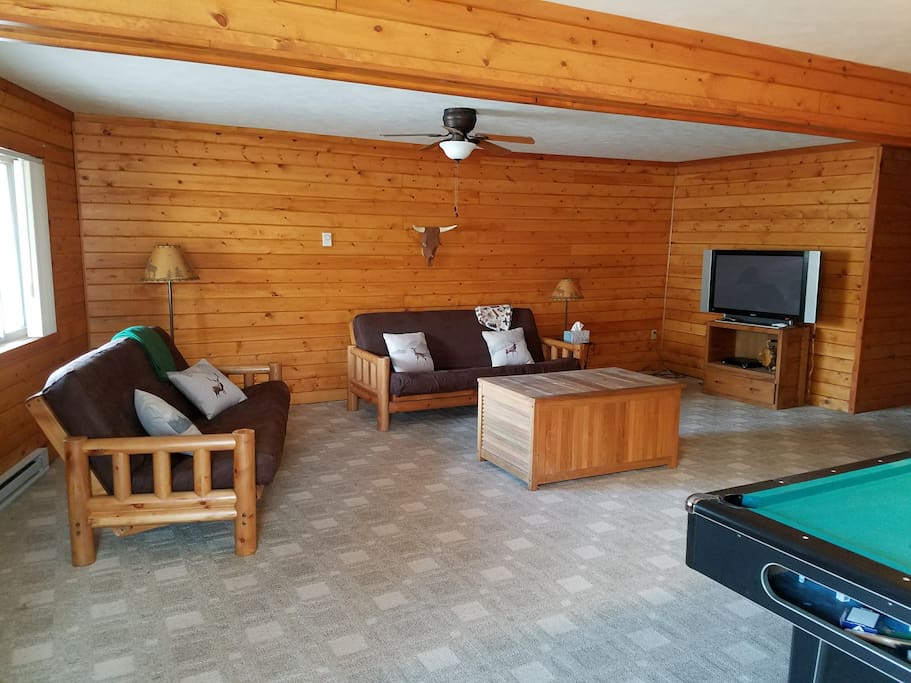 Downstairs den with pool table, 2 futons, and cable TV