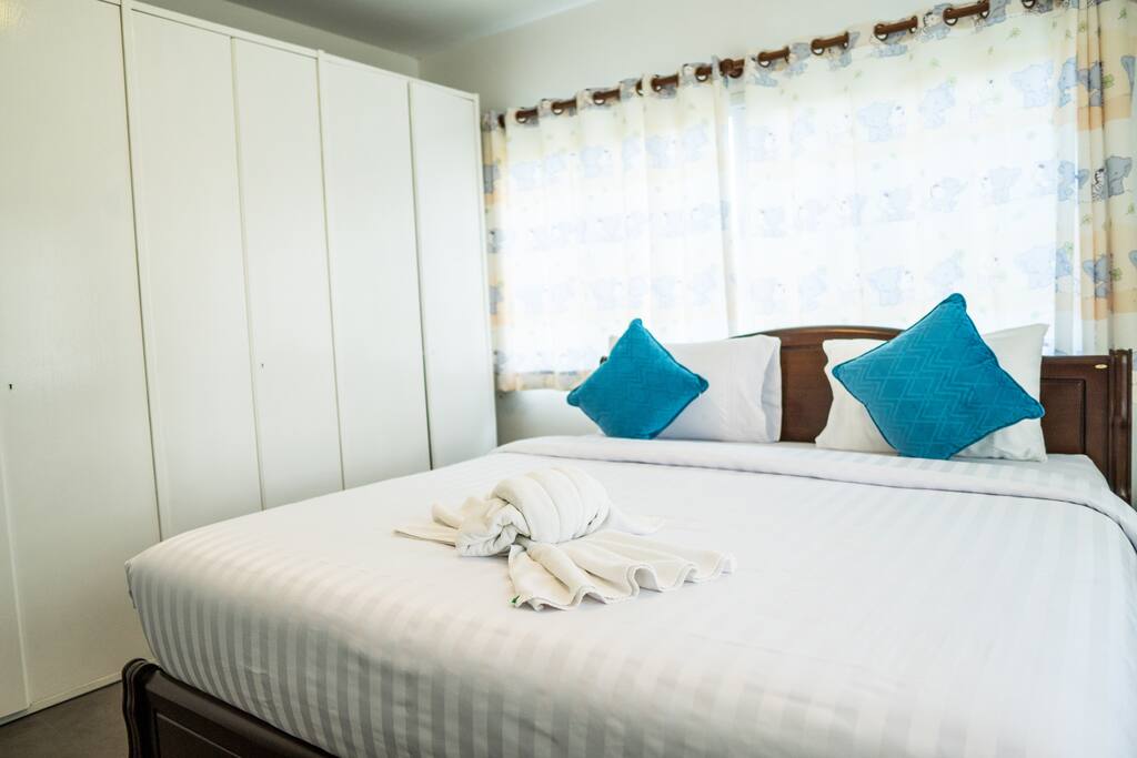 Third bedroom, surrounded by beautiful white drapes