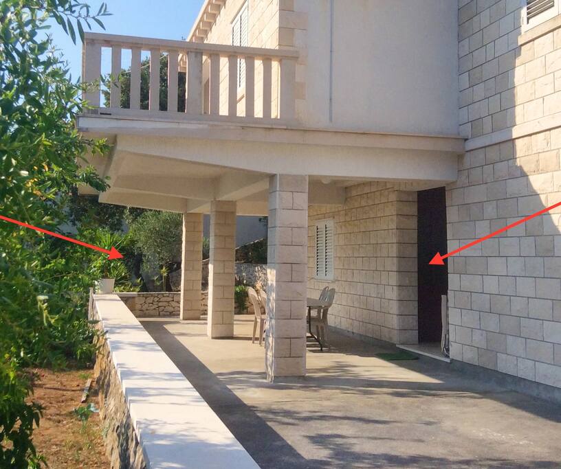 The apartment and patio are under the elevated terrace