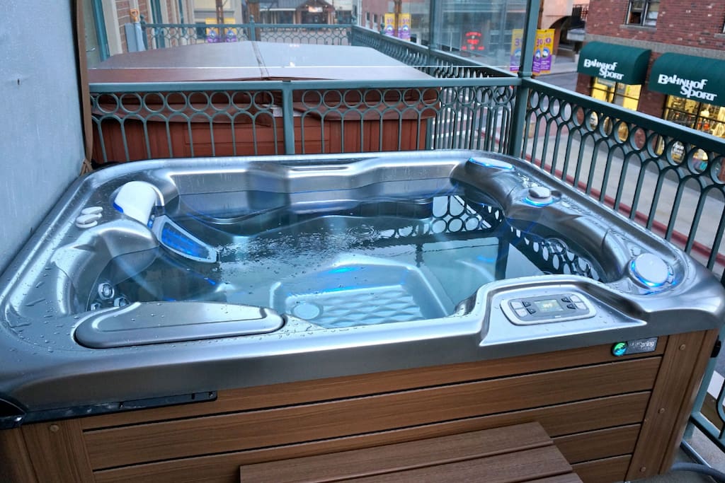 Brand new private hot tub on the balcony overlooking the mountain town.