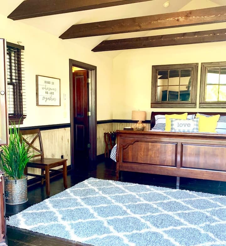 Rustic beam rafters with high vaulted ceilings. Gorgeous reclaimed hardwood floors. 