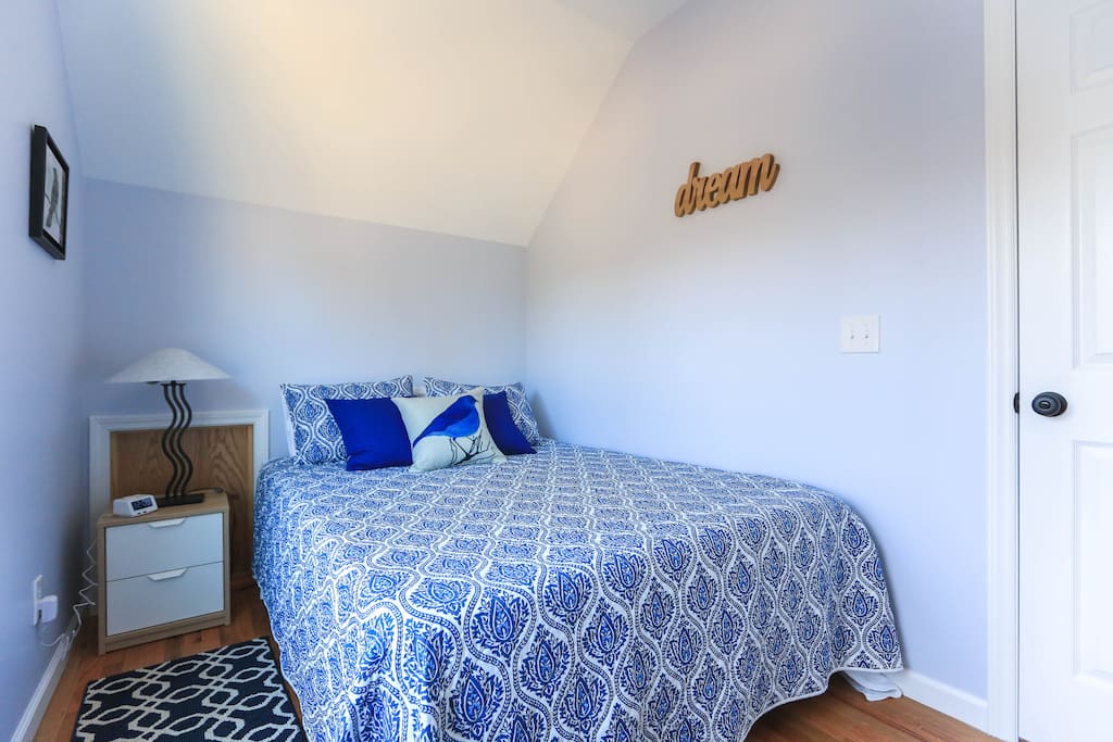 Alarm clock has USB ports to charge your phone or device. Brand new, firm memory foam mattress.