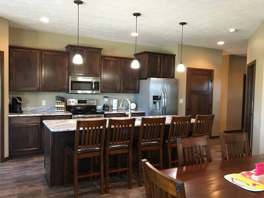 Well-stocked kitchen with seating for 5 at the island