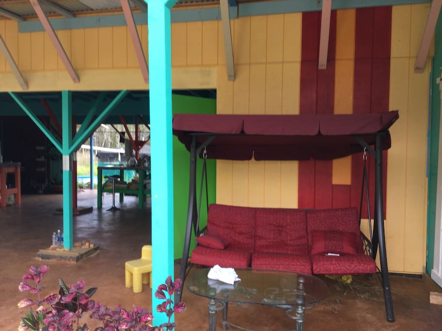 red swing chair next to door