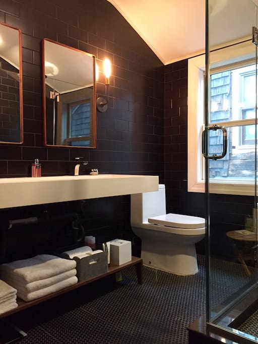 Private bath with double vanity, standing shower and toilet