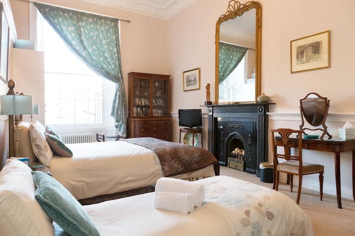 Bedroom 1 has a queen size bed and its original marble fireplace.