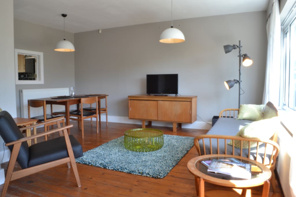 Kick back in the retro living space. Relax, dine, unwind