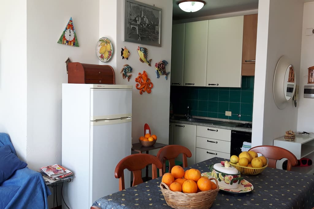Living room with kitchen, oranges and lemons of my garden :)