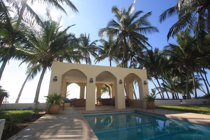One room in a beach-house at the Indian Ocean.