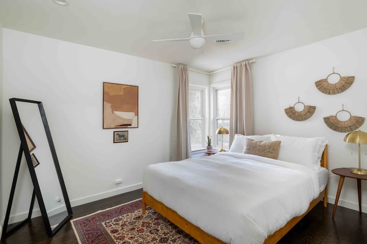 This bedroom gets great natural light and has a queen sized bed and walk in closet.