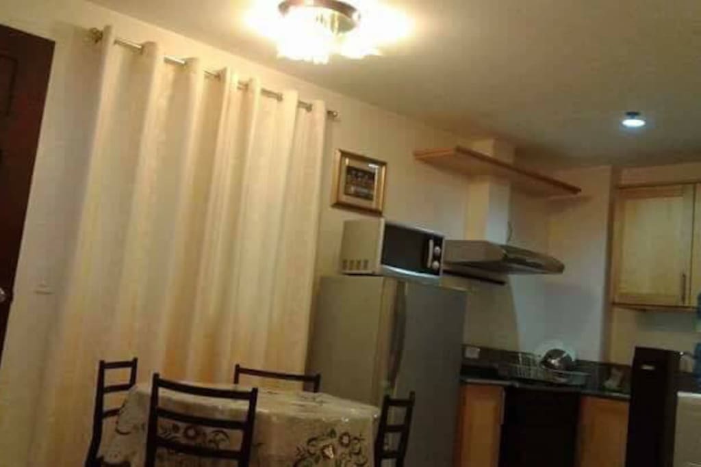 Dining table beside kitchen