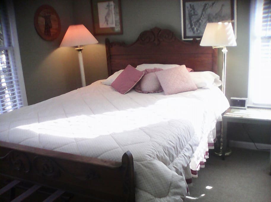 Bright, airy, queen bed with adjacent private bath