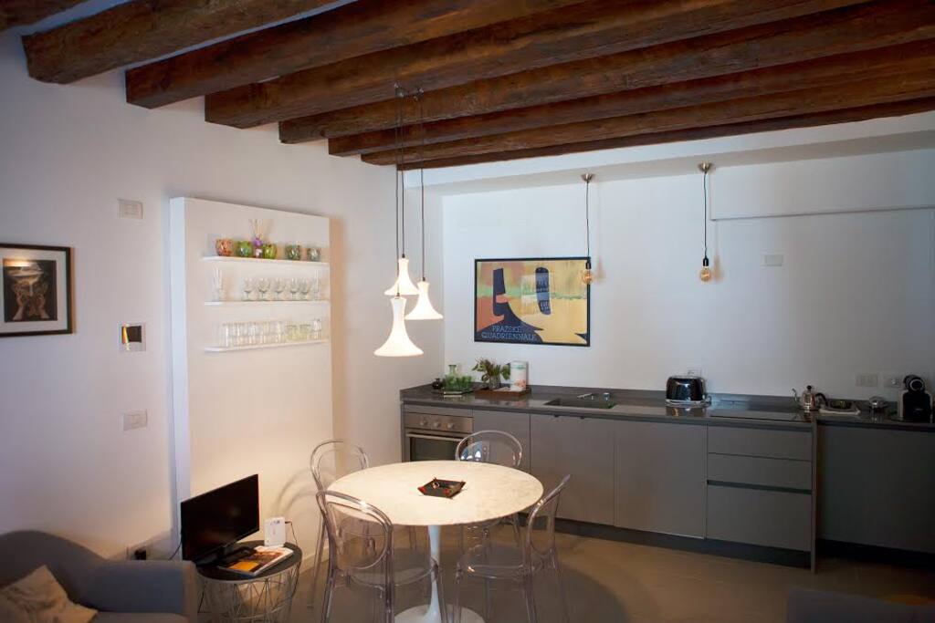 living room with fully equipped kitchen corner