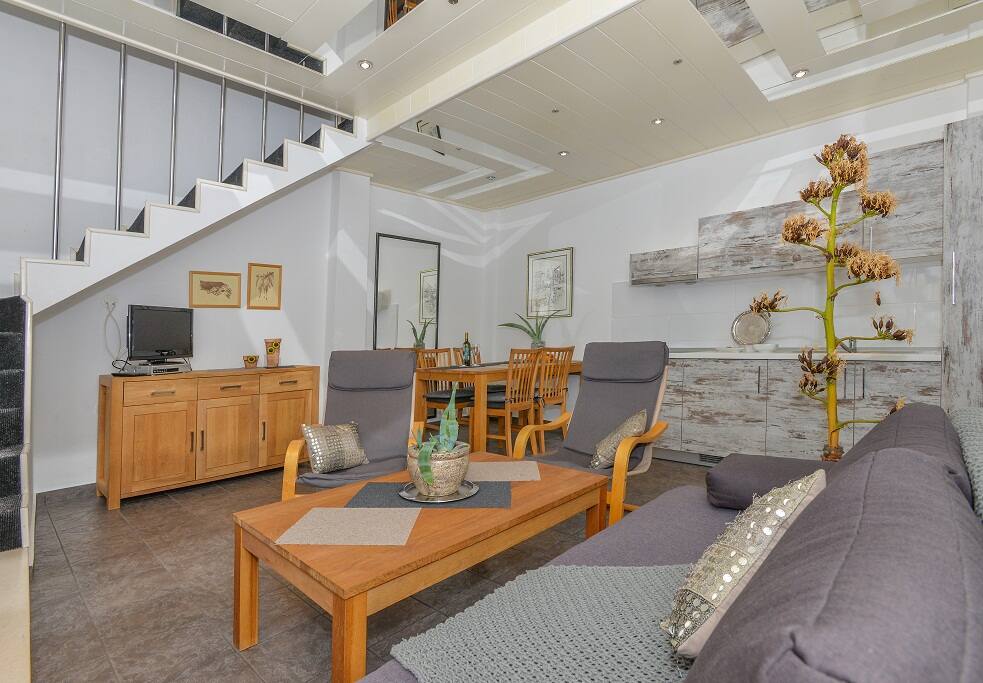 Kitchen, TV, couch, dining table