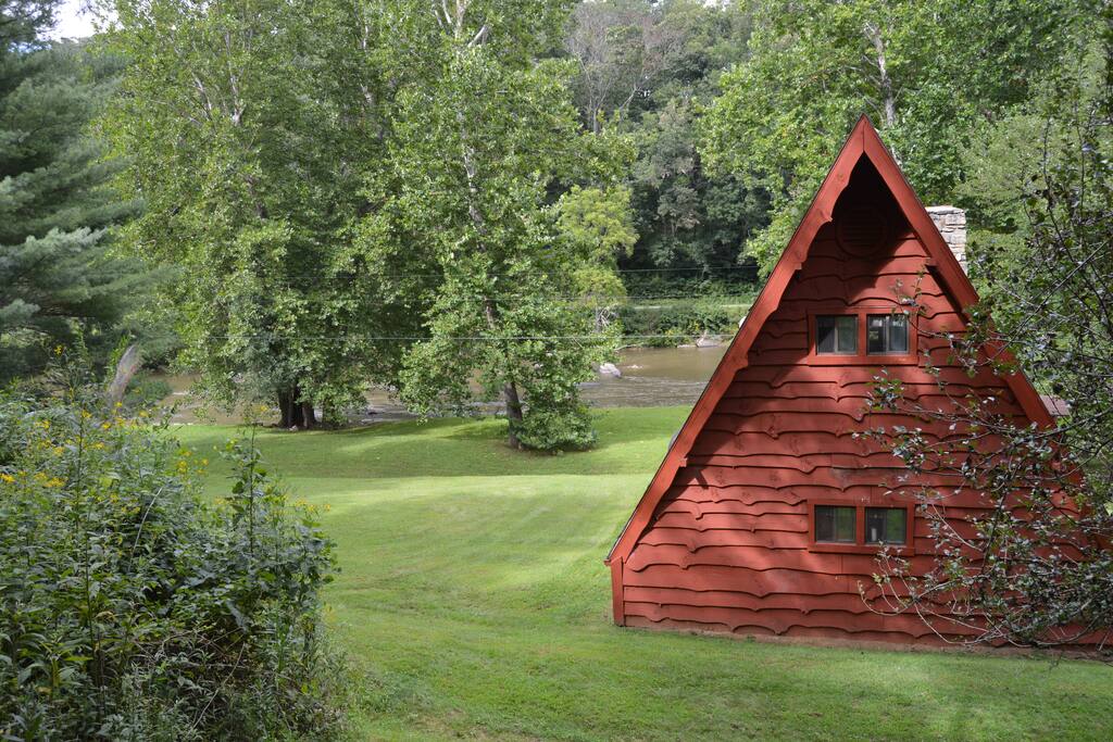 View of the side yard, river and cabin