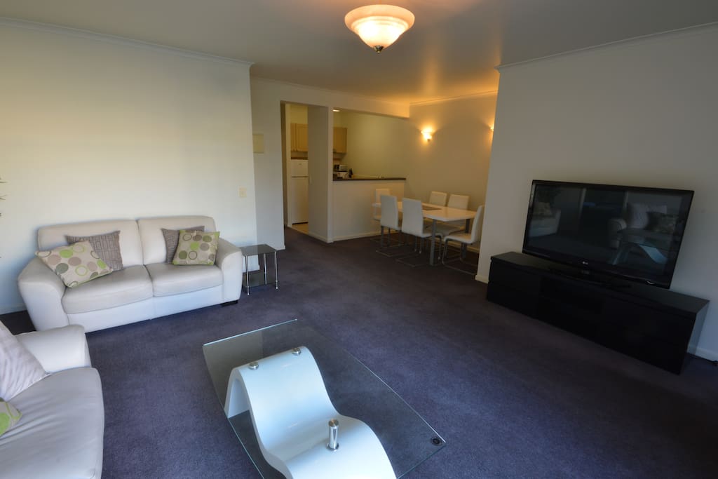 The lounge features a comfortable 3 seat and 2 seat leather lounge suite and leads to a balcony over looking the gardens