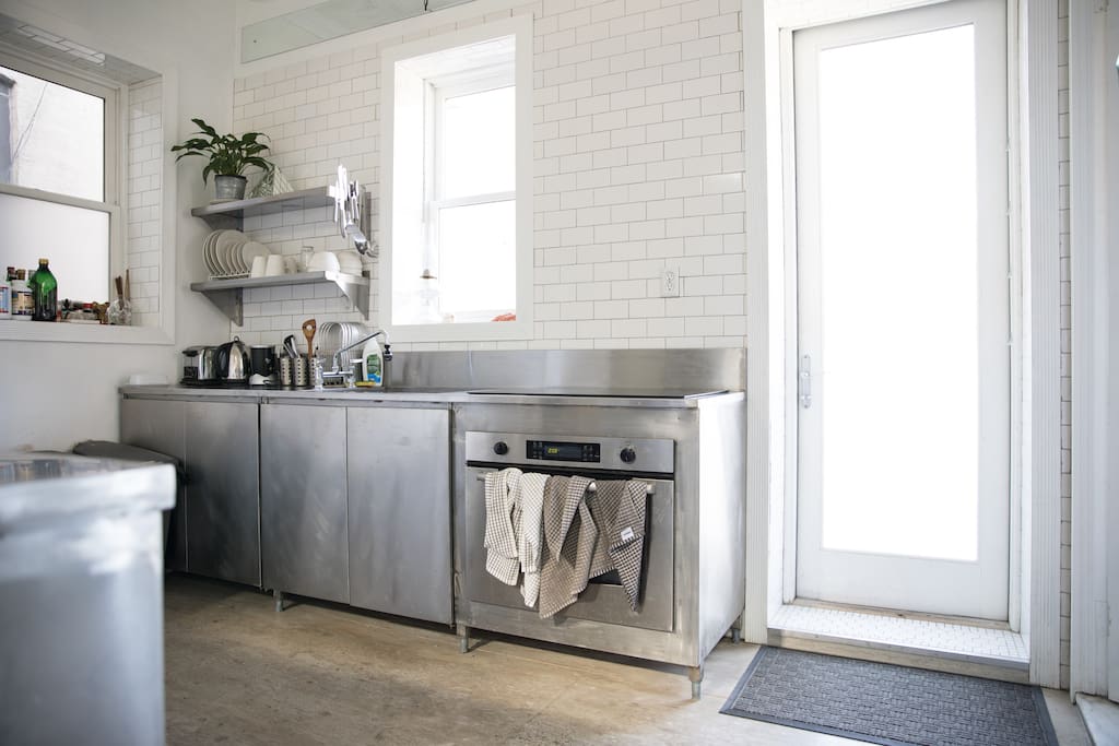 The kitchen is giant and ready for your cooking needs. Or it's just pretty to look at if you're more of an eat-out kind of person.