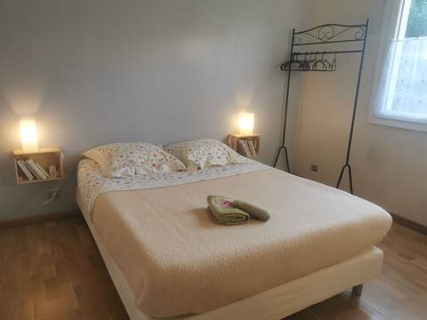 Room with private bathroom in detached house.