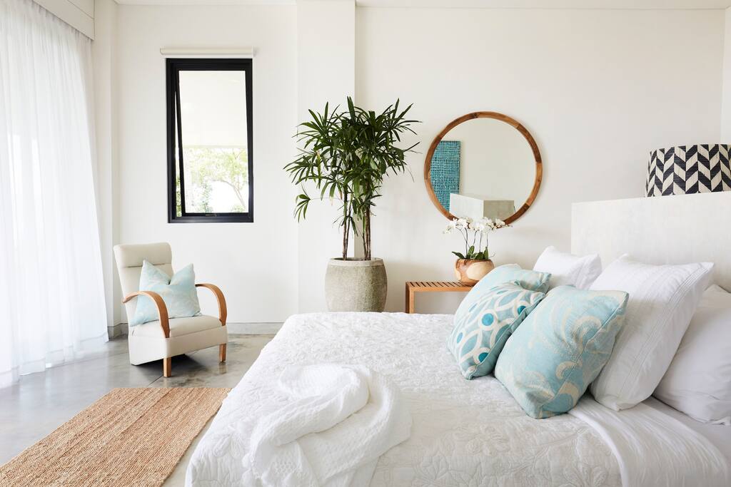 Bedroom 2 with dressing room, marble ensuite overlooks the pool and ocean