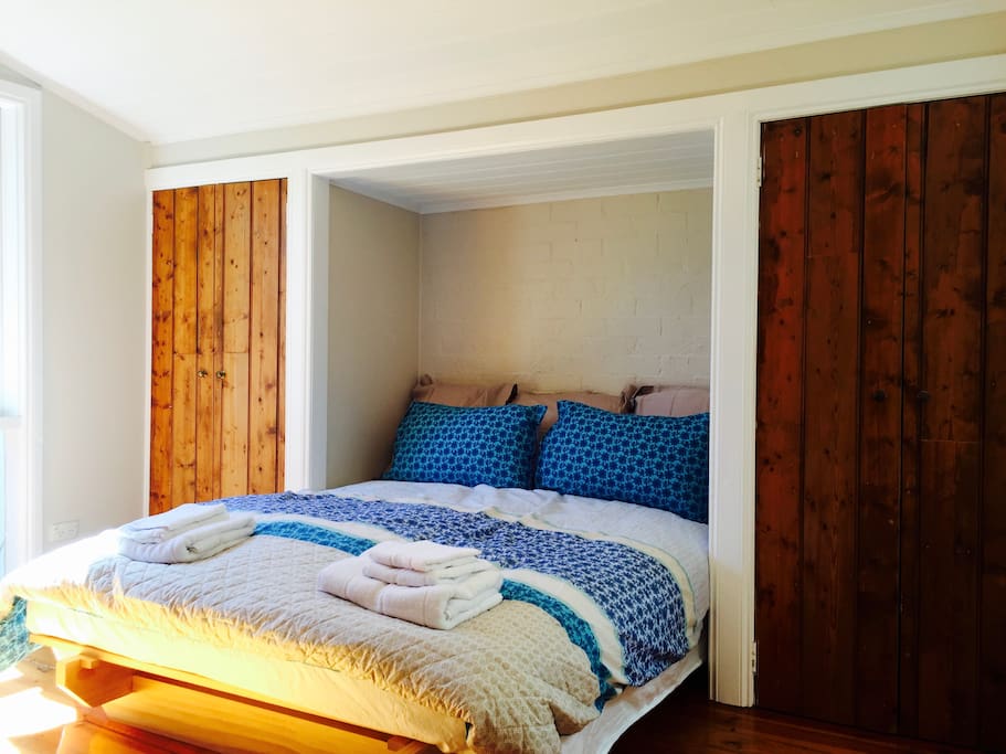 A super comfortable queen sized bed with handmade wooden closets. There is a beautiful old brick OFP for cosy nights in.