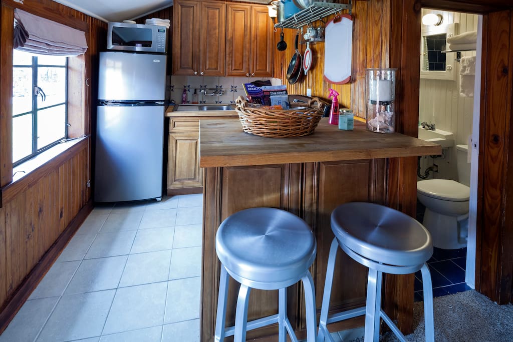 Open concept floor plan with additional storage under bar