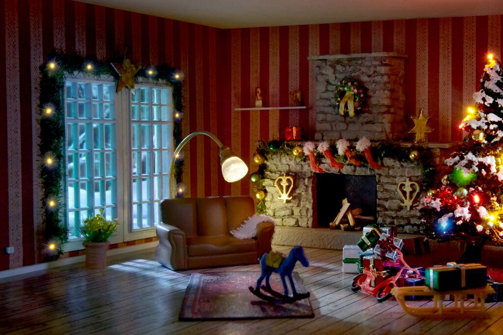 Everything you see is miniscule but the tiniest items of all are the Christmas stockings over the fireplace. Barely visible to the human eye, they are about the length of a standard pencil tip.