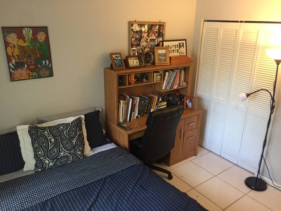 It has a pillow-top queen bed, a desk w/ book shelf, and a closet for you to use.