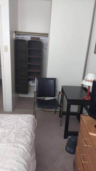 Large closet, chair and desk in your room.