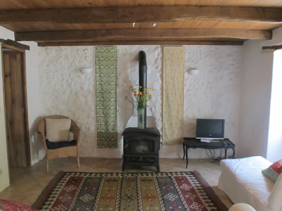 The living room has comfy sofas, a woodburner and tv/DVD.