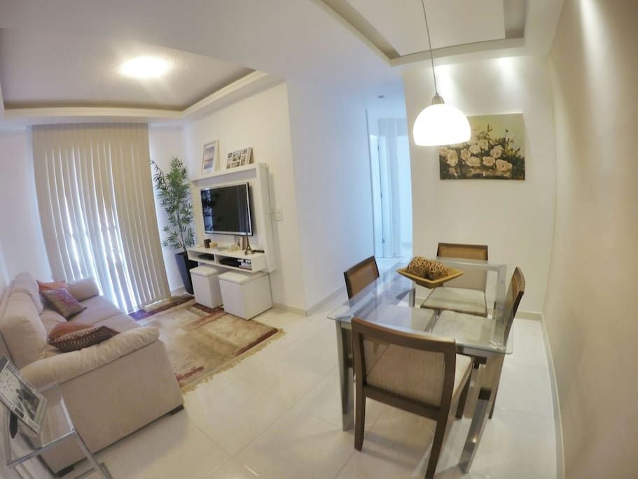Room with SmarTV , Internet Wifi , table, large sofa, table. Clean. Environment well lit and organized.