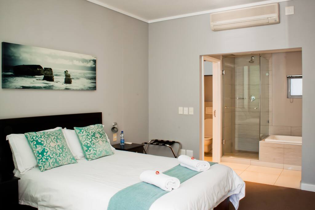 Bedroom open plan to living room and bathroom
